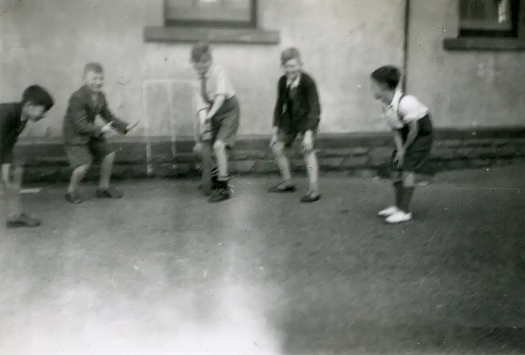 Playing cricket on the school yard