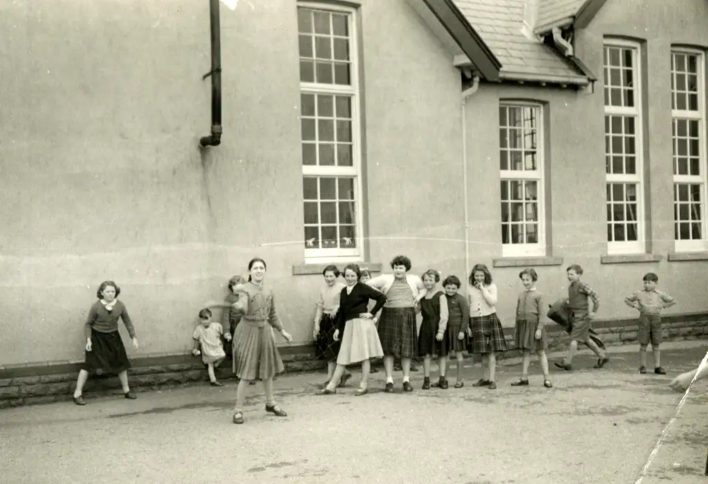 Playing rounders on the school yard
